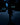 Man walking down a dark city street