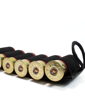 Image of the Esstac 6 Round 12 Gauge Shotgun Card, featuring durable elastic loops securely holding six shotgun shells, with a hook-and-loop backing for easy attachment to gear or firearms.