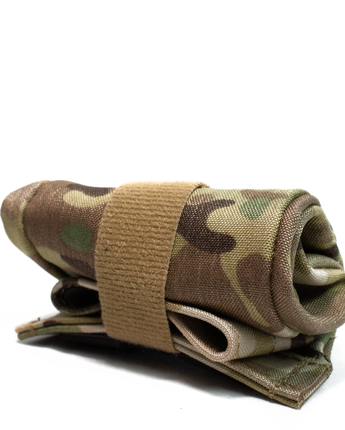 Image of the Esstac Mini Skittles Bag (Dump Pouch), showcasing its compact design with durable materials, cinch closure, and versatile attachment options for quick access to spent magazines or other gear in the field.