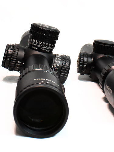 Image of high-performance weapon optics, showcasing precision scopes and red dot sights designed for improved accuracy, target acquisition, and durability in tactical and shooting applications.